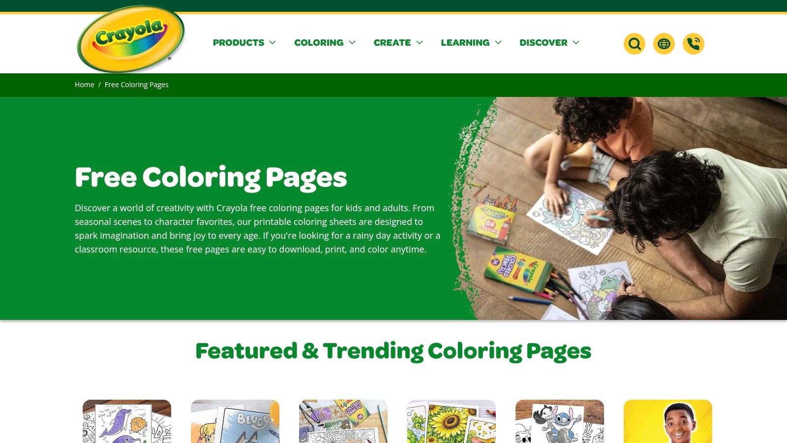 A child happily colouring in a detailed cartoon scene with Crayola crayons.